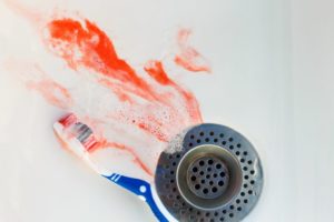 blood in sink by toothbrush