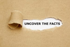 paper that says "uncover the facts"