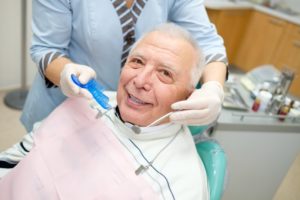 older man smiling with dental implants in Houston
